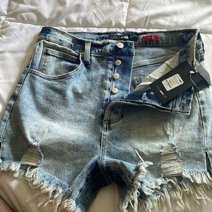 BRAND NEW. Never worn. Fashion Nova Denim shorts with side split hem.